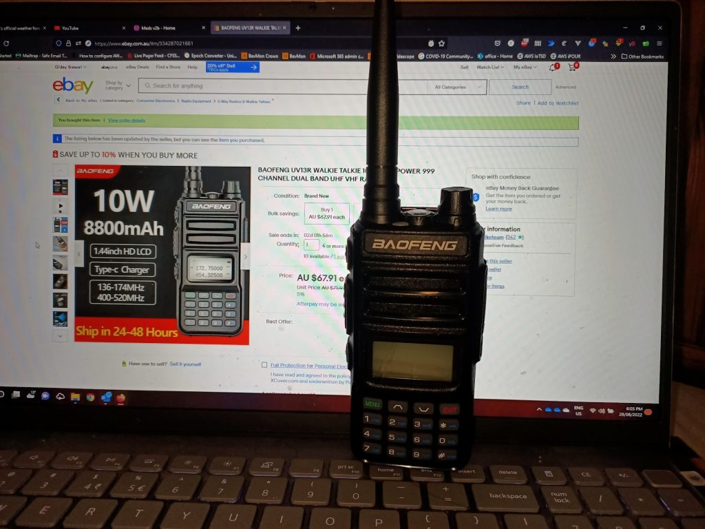 Baofang UV13R with ebay page behind it